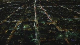 DCA07_064 - 4K aerial stock footage of Wilshire Boulevard through Koreatown, Los Angeles, California, night