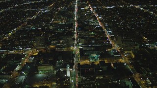DCA07_065 - 4K aerial stock footage of following Wilshire Boulevard through Koreatown, Los Angeles, California, night