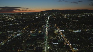 DCA07_067 - 4K aerial stock footage of following Wilshire Blvd through Koreatown to Century City, Los Angeles, California, night