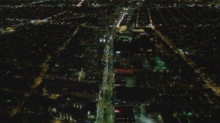 DCA07_075 - 4K aerial stock footage of following Wilshire Blvd through Mid-Wilshire, Los Angeles, California, night