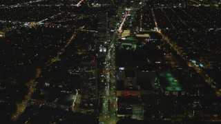 DCA07_076 - 4K aerial stock footage of following Wilshire Blvd through Mid-Wilshire, Los Angeles, California, night