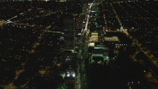 DCA07_077 - 4K aerial stock footage of following Wilshire Blvd through Mid-Wilshire, Los Angeles, California, night