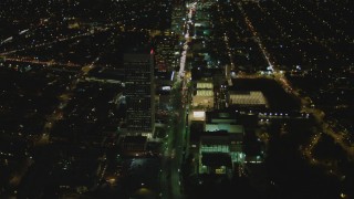 DCA07_078 - 4K aerial stock footage of following Wilshire Blvd through Mid-Wilshire, Los Angeles, California, night