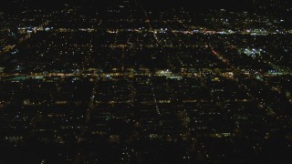 DCA07_081 - 4K aerial stock footage of approaching residential neighborhoods, West Hollywood, California, night