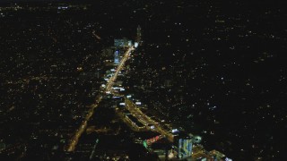 DCA07_094 - 4K aerial stock footage of approaching the Sunset Strip, West Hollywood, California, night