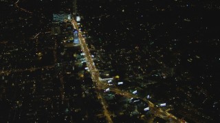 DCA07_095 - 4K aerial stock footage of flying by Sunset Strip, West Hollywood, California, night