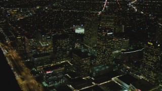 DCA07_101 - 4K aerial stock footage of flying away from skyscrapers, Century City, California, night