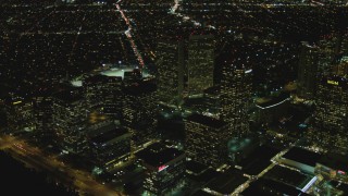 DCA07_102 - 4K aerial stock footage of flying by skyscrapers, Century City, California, night