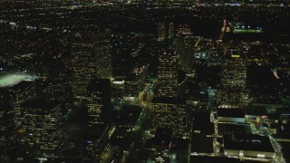 DCA07_103 - 4K aerial stock footage of flying by skyscrapers, revealing Avenue of the Stars, Century City, California, night