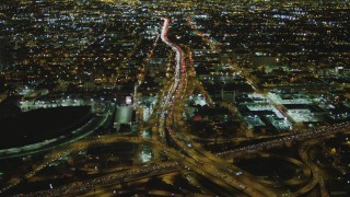 DCA07_110 - 4K aerial stock footage of approaching Interstate 110 and Interstate 10 interchange, Downtown, Los Angeles, California, night