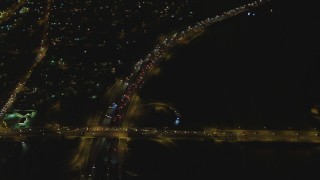 DCA07_117 - 4K aerial stock footage of flying away from Interstate 710, Lynwood, California, night