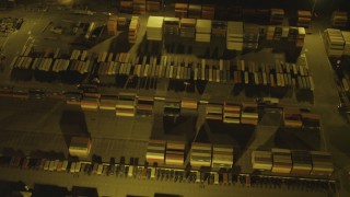 DCA07_138 - 4K aerial stock footage of a bird's eye view flying over cargo containers, Port of Long Beach, California, night
