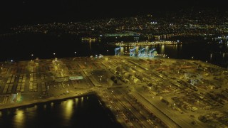 DCA07_152 - 4K aerial stock footage of panning across cargo containers, Port of Los Angeles, San Pedro, California, night