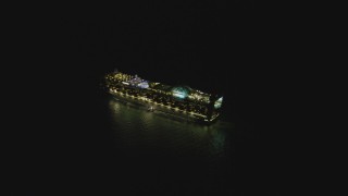 DCA07_153 - 4K aerial stock footage of orbiting a cruise ship sailing near Port of Los Angeles, San Pedro, California, night