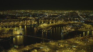 DCA07_162 - 4K aerial stock footage of the Port of Los Angeles, Vincent Thomas Bridge, San Pedro, California, night