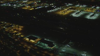 DCA07_166 - 4K aerial stock footage of a passenger jet taxiing, LAX (Los Angeles International Airport), Los Angeles, California, night