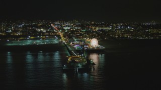 DCA07_173 - 4K aerial stock footage of passing by the Santa Monica Pier, Santa Monica, California, night