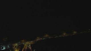 DCA07_175 - 4K aerial stock footage of bird's eye view panning across Highway 1, Pacific Palisades, California, night