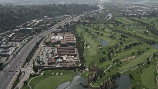DCA08_004 - 4K aerial stock footage pan across Interstate 8 to reveal golf course, Mission Valley, California
