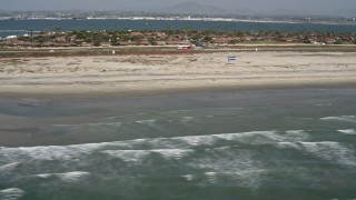 DCA08_026 - 4K aerial stock footage of ocean waves and beach in Coronado, California