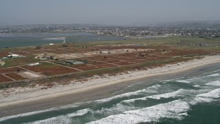 DCA08_031 - Aerial stock footage of 4K aerial \video of a beachside military base, Chula Vista, California