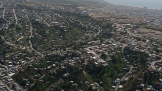 DCA08_044 - 4K aerial stock footage flyby urban residential neighborhoods in Tijuana, Mexico