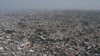 DCA08_047 - 4K aerial stock footage of a view of dense urban neighborhoods in Tijuana, Mexico