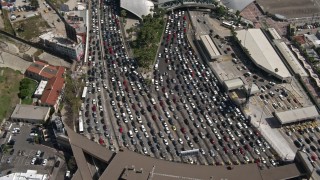 DCA08_052E - 4K stock footage aerial video orbit heavy border checkpoint traffic, US/Mexico Border, Tijuana