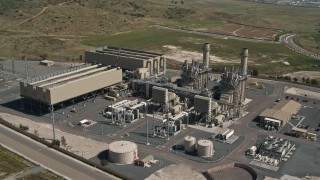 DCA08_097E - 4K aerial stock footage of an orbit of a power plant in Otay Mesa, California