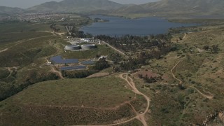DCA08_107 - 4K aerial stock footage of a lakeside water treatment plant, Lower Otay Lake, California