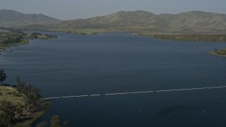 DCA08_108 - 4K aerial stock footage fly over a water treatment plant to reveal Lower Otay Lake, California