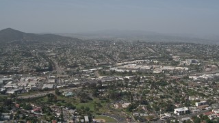 DCA08_133 - 4K aerial stock footage tilt from suburban homes to reveal shopping mall, La Mesa, California