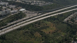 DCA08_135E - 4K aerial stock footage of tracking light traffic on Interstate 8, Del Cerro, California