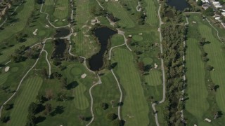 DCA08_139 - 4K aerial stock footage of orbiting a golf course in Grantville, California