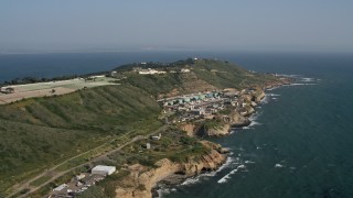 DCA08_165 - 4K aerial stock footage of coastal cliffs and a water treatment plant, Point Loma, California