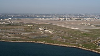 DCA08_170 - 4K aerial stock footage of bunkers and runways on an island military base, Naval Air Station North Island, California