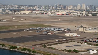 DCA08_172 - 4K aerial stock footage of military jets and helicopters on an island base, Naval Air Station North Island, California