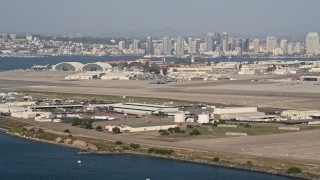 DCA08_173 - 4K aerial stock footage of runways  and hangars on an island military base, Naval Air Station North Island, California