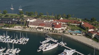 DCA08_175 - 4K aerial stock footage of a reverse view of an oceanfront hotel, Shelter Island, California