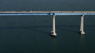 DCA08_183 - 4K stock footage aerial video tilt from sailboat to reveal the Coronado Bridge, San Diego, California