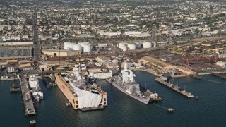 DCA08_184 - 4K aerial stock footage of warships at naval shipyard, San Diego, California