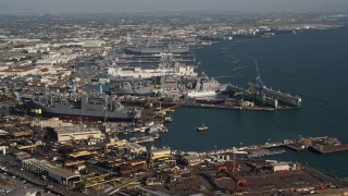 DCA08_190 - 4K aerial stock footage of naval warships under construction in San Diego, California