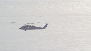 DCA08_215 - 4K aerial stock footage track military helicopter near Naval Air Station North Island, California