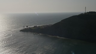 DCA08_218 - 4K aerial stock footage of flying toward an oceanfront lighthouse, Point Loma, California