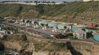 DCA08_220 - 4K aerial stock footage flyby an oceanfront water treatment plant, Point Loma, California