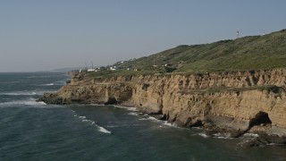 DCA08_222 - 4K aerial stock footage of passing coastal cliffs in Point Loma, California