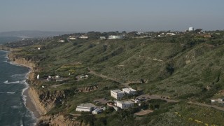 DCA08_223 - 4K aerial stock footage of a satellite dish and scientific facility on coastal cliffs, Point Loma, California