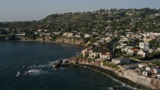 DCA08_240 - 4K aerial stock footage pan across upscale, oceanfront homes and cliffs, La Jolla, California