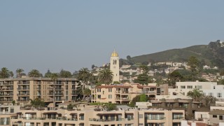 DCA08_244 - 4K aerial stock footage flyby beachfront condos and focus on a church steeple, La Jolla, California