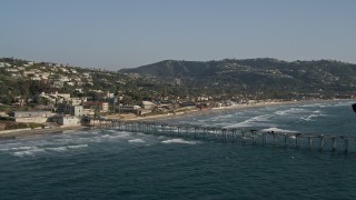 DCA08_249 - 4K aerial stock footage tilt from the ocean to reveal a pier in La Jolla, California